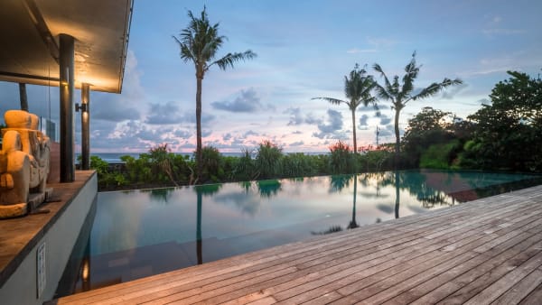 Arnalaya Beach House - Dramatic sunset view from the pool